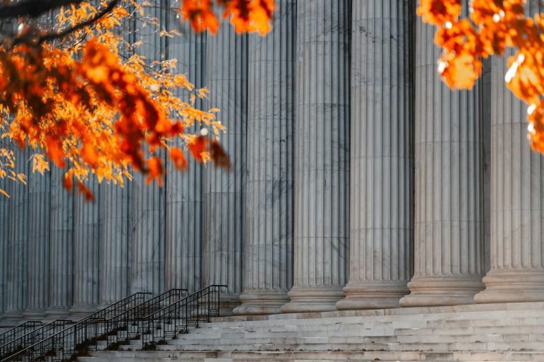 a building with columns and steps in front of it